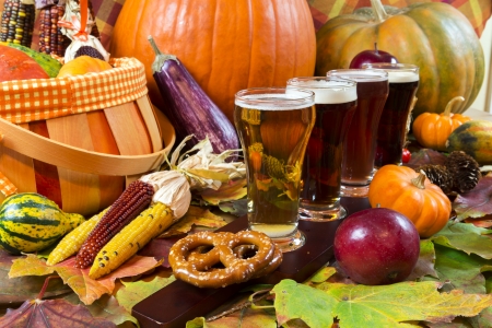 oktoberfest beer flight of four samples with fall seasonal decorationの写真素材