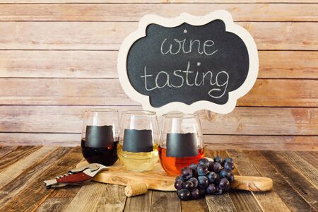 Three color wine flight in chalkboard glasses with a signの写真素材