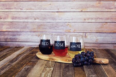 Three color wine flight in label glassesの写真素材