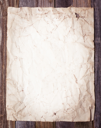 Blank page of old vintage paper on wooden backgroundの写真素材