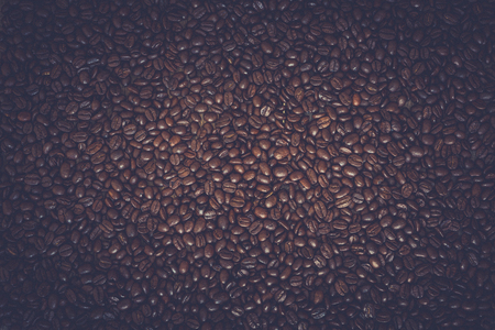 Rich brown roasted coffee beans backgroundの写真素材