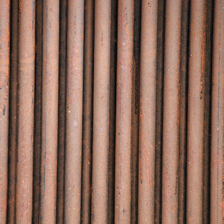 The rusty old metal fenceの写真素材