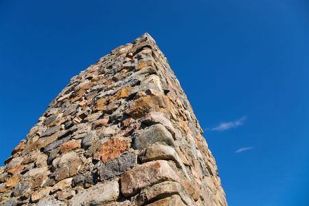 Stone column on a background of the blue skyの写真素材