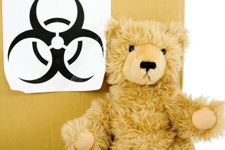 Toy bear and sign biohazard on the white backgroundの写真素材