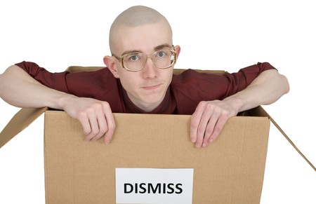 Man in carton with inscription "Dismiss"の写真素材