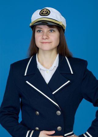Portrait of the girl - captain on a blue backgroundの写真素材