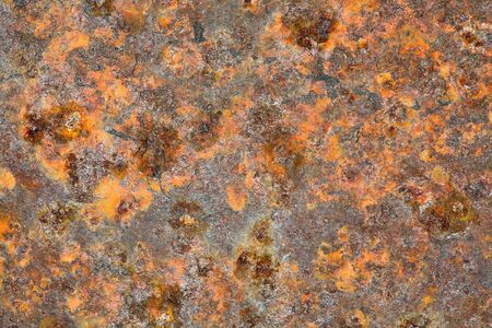 Grunge metal old brown rusty uneven backgroundの写真素材