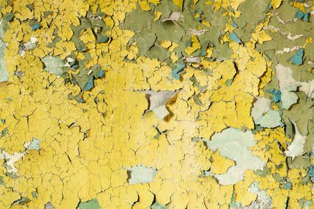 Old damaged paint on a concrete wall backgroundの写真素材