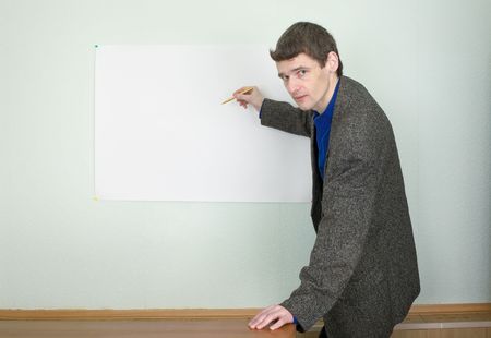 Teacher telling about something and showing on the posterの写真素材