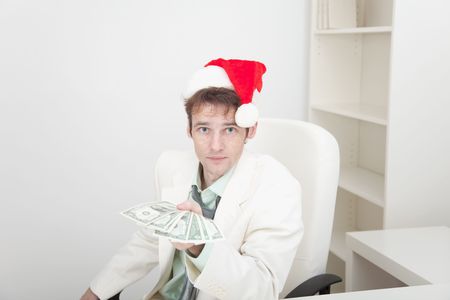 The guy in a Christmas hat gives us moneyの写真素材