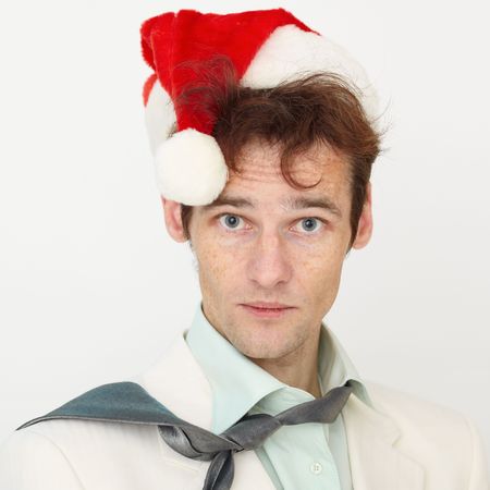 Portrait of the person with a New Year s hat on a white backgroundの写真素材