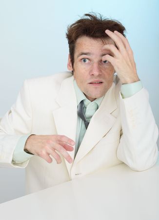 The young amusing tousled scared person in a white jacketの写真素材