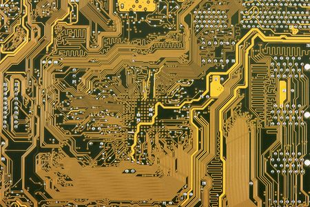 Golden industrial circuit board electronic backgroundの写真素材