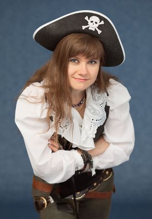 Woman in costume a sea pirate on blue backgroundの写真素材