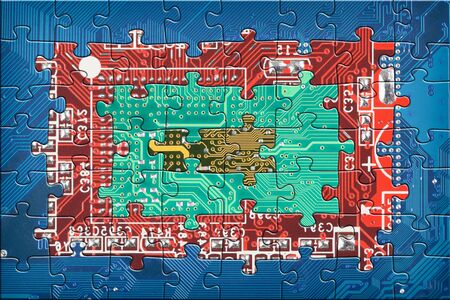 Abstract multicolor electronic circuit board puzzle backgroundの写真素材