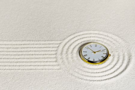 Surrealistic composition with golden watch on the sandの写真素材