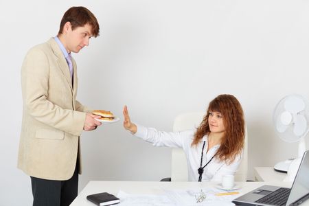 Woman refuses to eat because is on a dietの写真素材