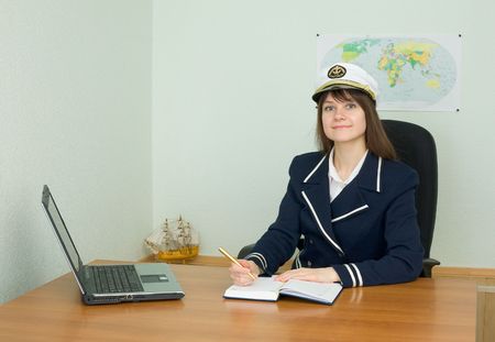 Girl in uniform sailor in the officeの写真素材