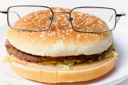 Jolly clever sandwich with glasses on a plateの写真素材
