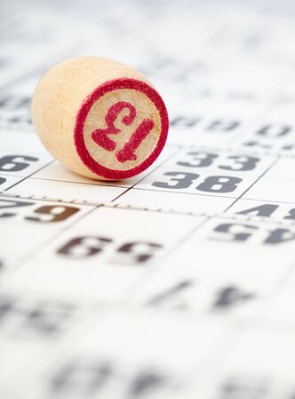 The chip with the number thirteen on the background of the cardsの写真素材