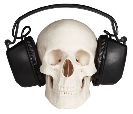 The human skull with music headphones on a white backgroundの写真素材