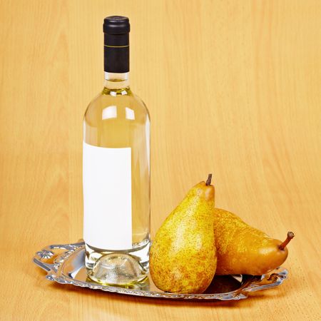 Still life from a bottle of pear wine on the tableの写真素材
