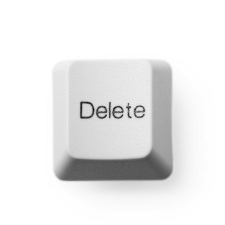 Computer button labeled - delete, on a white backgroundの写真素材