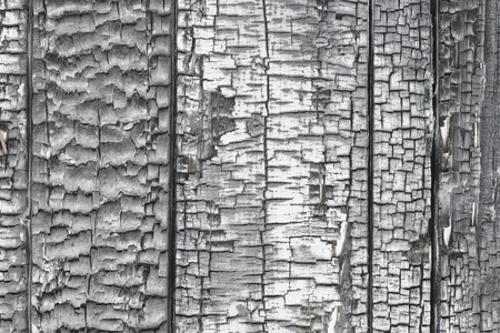 The wooden wall is damaged by fireの写真素材