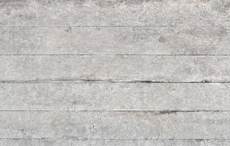 Wallpaper of the gray planks covered with a rough old paintの写真素材