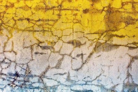 Old concrete wall with cracks - color illuminationの写真素材