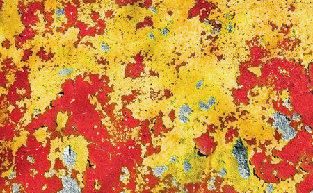 The peeled wall of the thrown building with a red paintの写真素材