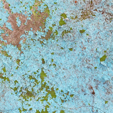 The wall surface of the stone building with damaged paintの写真素材