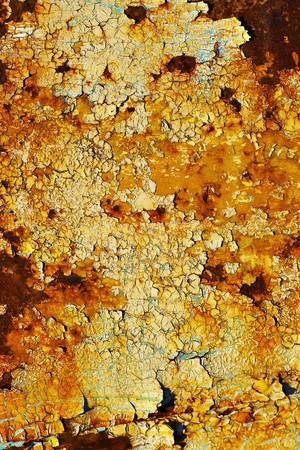Surface covered with cracks and rust spotsの写真素材
