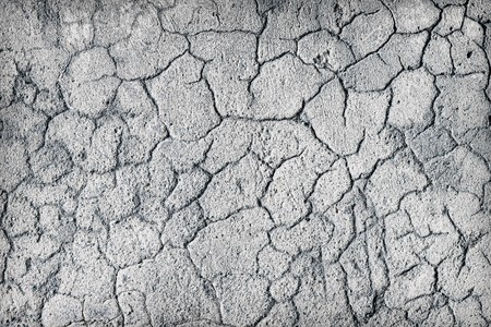 Deep large cracks on the surface of old plasterの写真素材