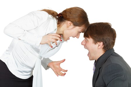 Shouting at each other man and woman on white backgroundの写真素材