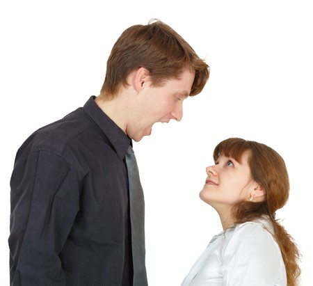 The man angrily shouted at the young womanの写真素材