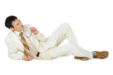 Thinking the young man lies, isolated on a white backgroundの写真素材