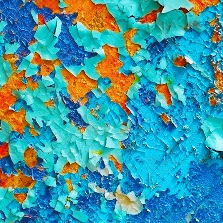 Beautiful colored pieces of old paint - a fragment of the wallの写真素材