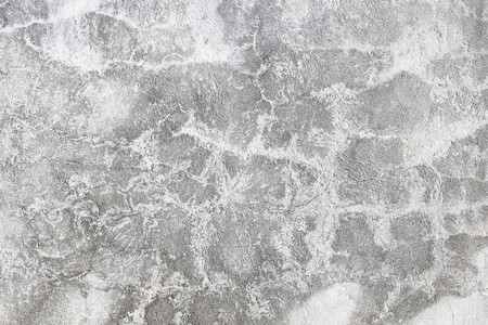 Grey plaster on the old cracked wallの写真素材