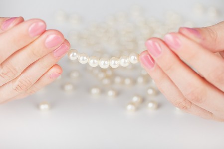 The Beads from artificial pearls in handsの写真素材