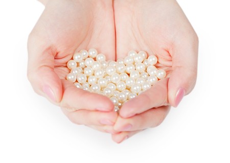 Handful of pearls isolated on a white backgroundの写真素材