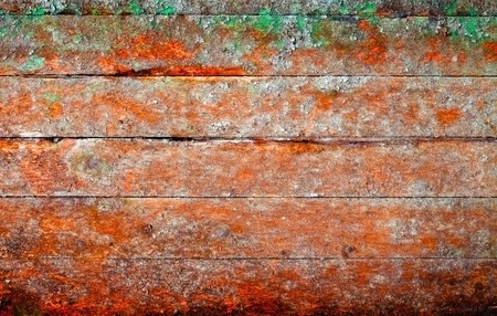 Very old rotten boards with stains of different color - a background in style of a retroの写真素材