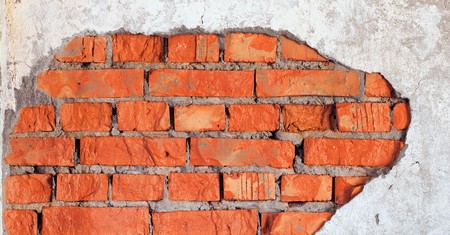 The big damage of a brick wall - an industrial urbanistic backgroundの写真素材