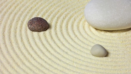 Abstract composition of a few stones on the sandの写真素材