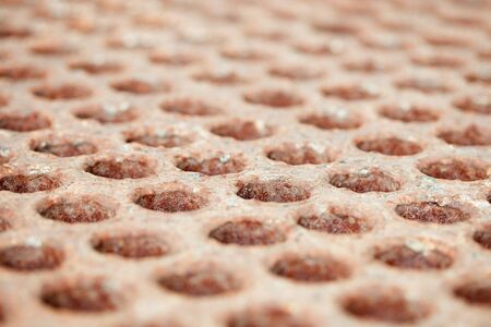 Rusty surface with holes - a close upの写真素材