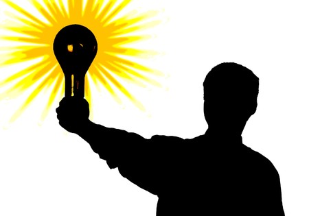 Silhouette of the man with a bulb - idea in a hand. An illustrationの写真素材