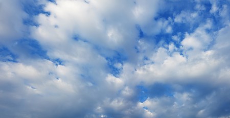 White cumulus clouds in the summer blue skyの写真素材