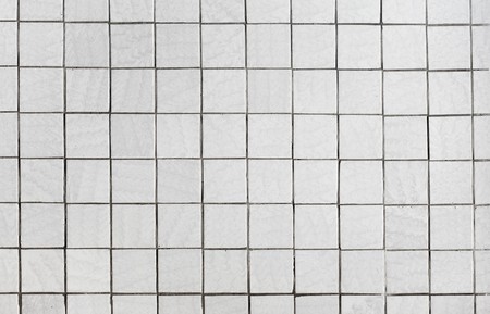 Wall surface covered with a gray tileの写真素材