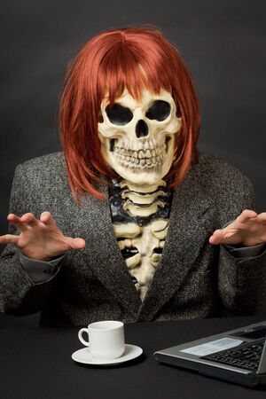 The amusing skeleton with red hair tries to frighten usの写真素材
