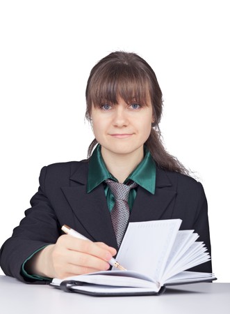 The young woman - the student does records in a notebookの写真素材